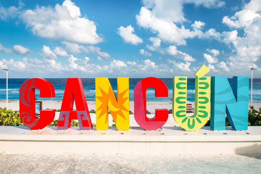 cancun sign beach