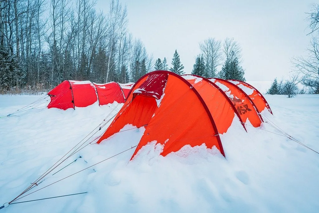 tent ice crystals burning with red yellow fire. Cold winter frozen